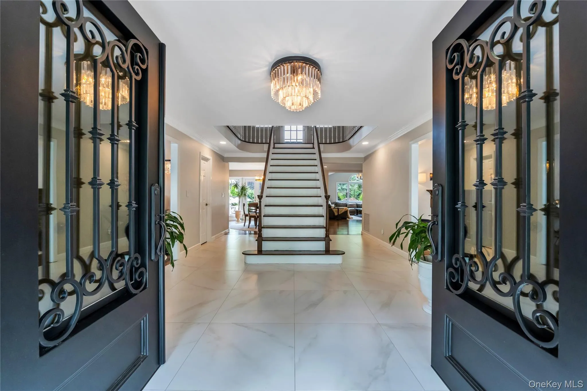Entryway with custom iron cast french style double doors. Entryway with custom iron cast french style double doors.