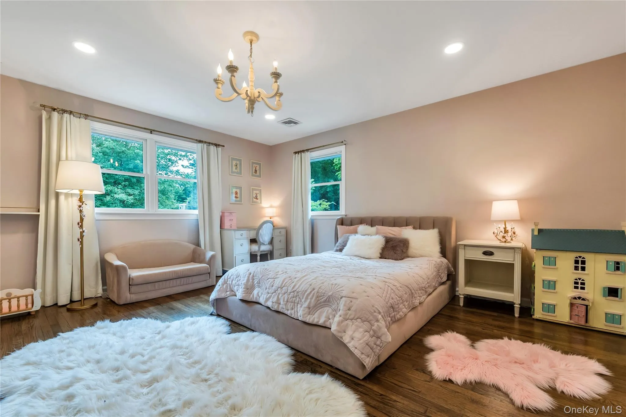 Bedroom featuring a chandelier, multiple windows, wood finished floors, and recessed lighting Bedroom featuring a chandelier, multiple windows, wood finished floors, and recessed lighting