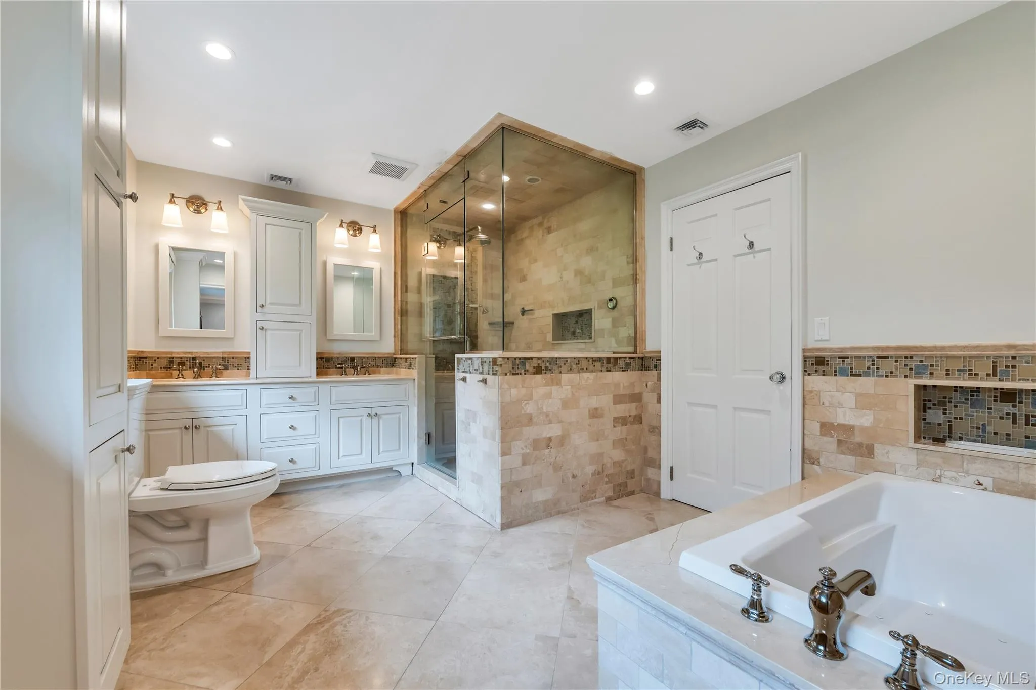 Full bath with a garden tub, double vanity, a stall shower, recessed lighting, and tile patterned floors Full bath with a garden tub, double vanity, a stall shower, recessed lighting, and tile patterned floors
