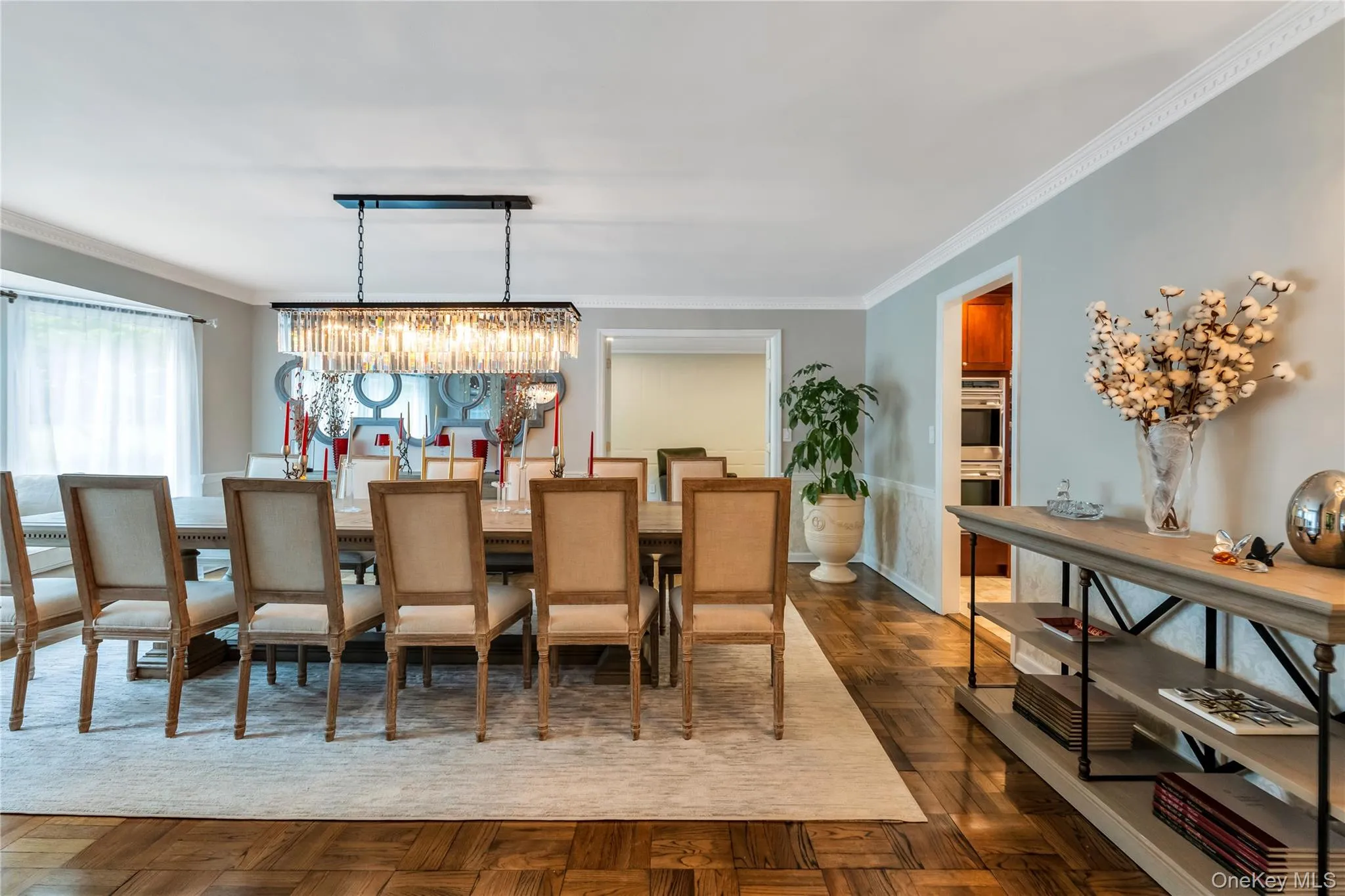 Dining room featuring a chandelier and ornamental molding Dining room featuring a chandelier and ornamental molding