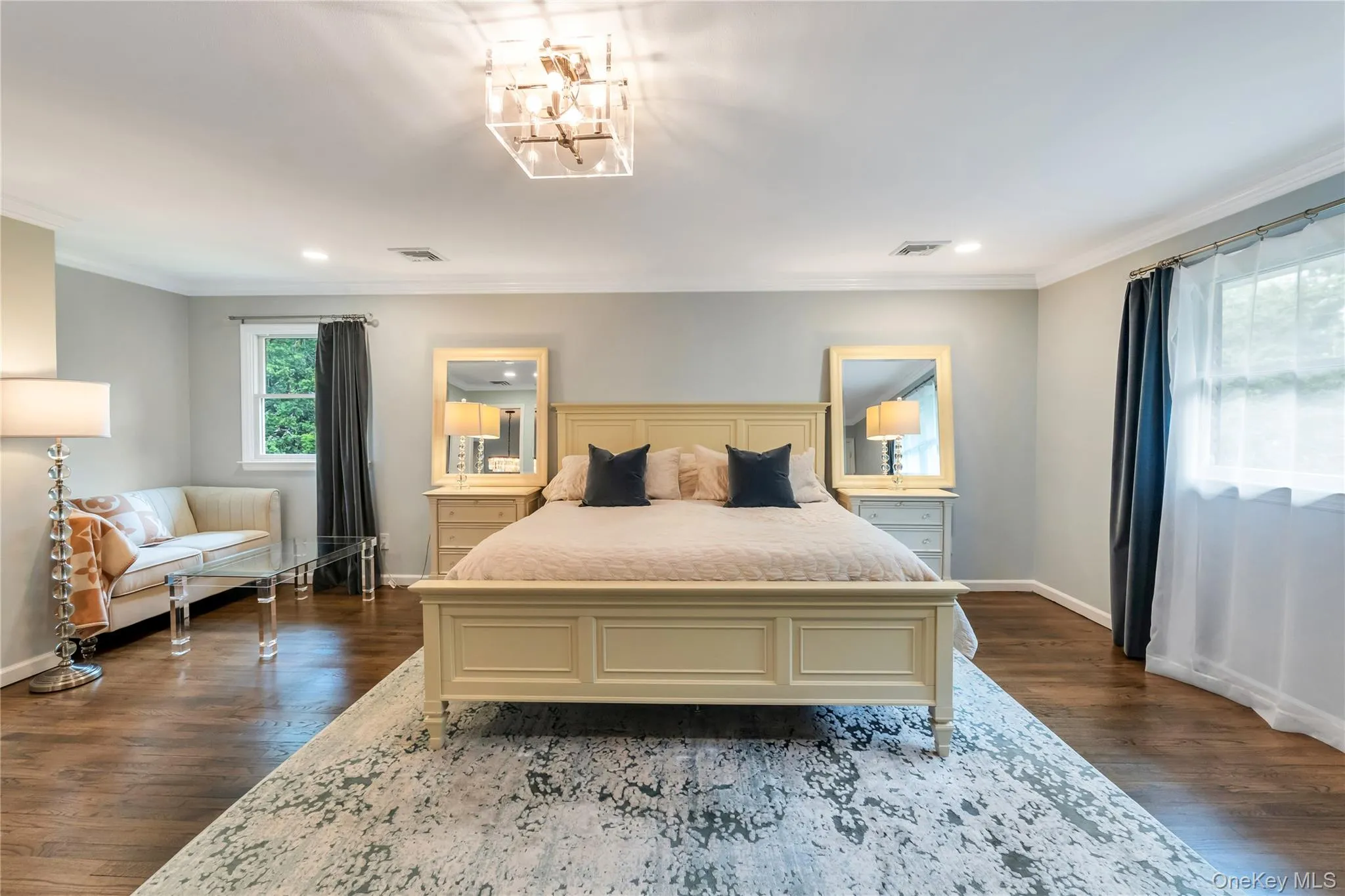 Bedroom with baseboards, crown molding, dark wood finished floors, a chandelier, and recessed lighting Bedroom with baseboards, crown molding, dark wood finished floors, a chandelier, and recessed lighting