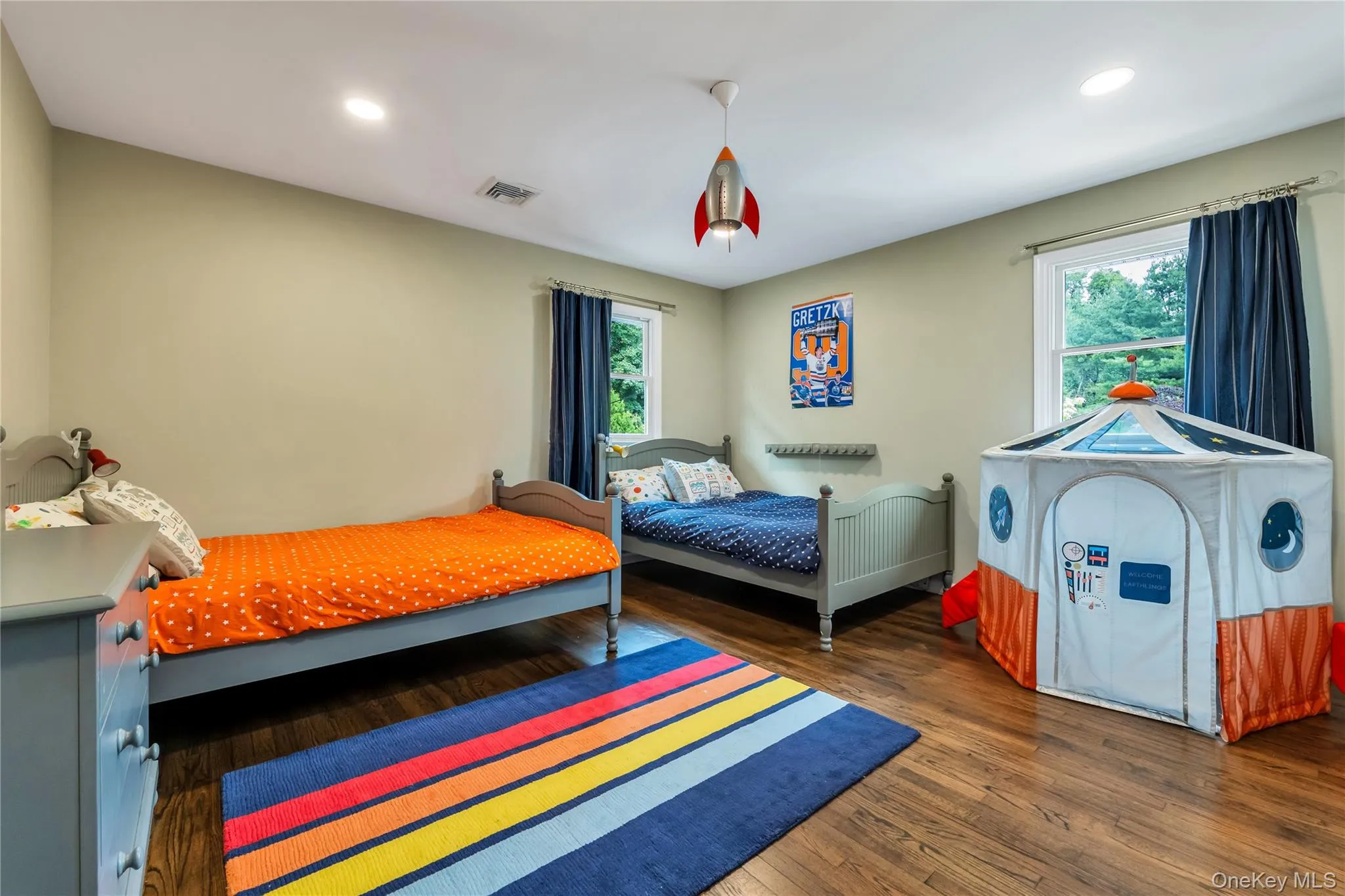 Bedroom with wood finished floors and recessed lighting Bedroom with wood finished floors and recessed lighting