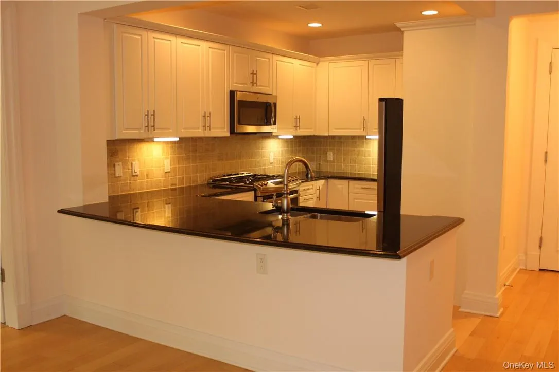 Custom cabinetry, SS appliances and granite counter tops. Custom cabinetry, SS appliances and granite counter tops.