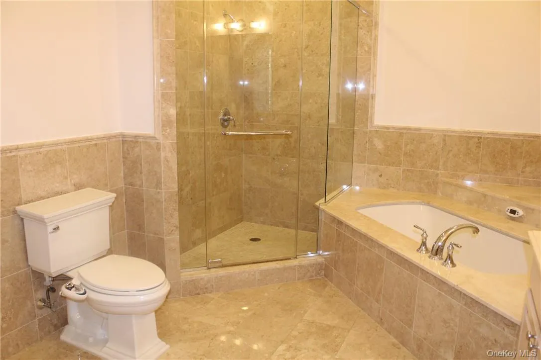 The en suite is fully tiled with walk in shower and jetted tub. The en suite is fully tiled with walk in shower and jetted tub.