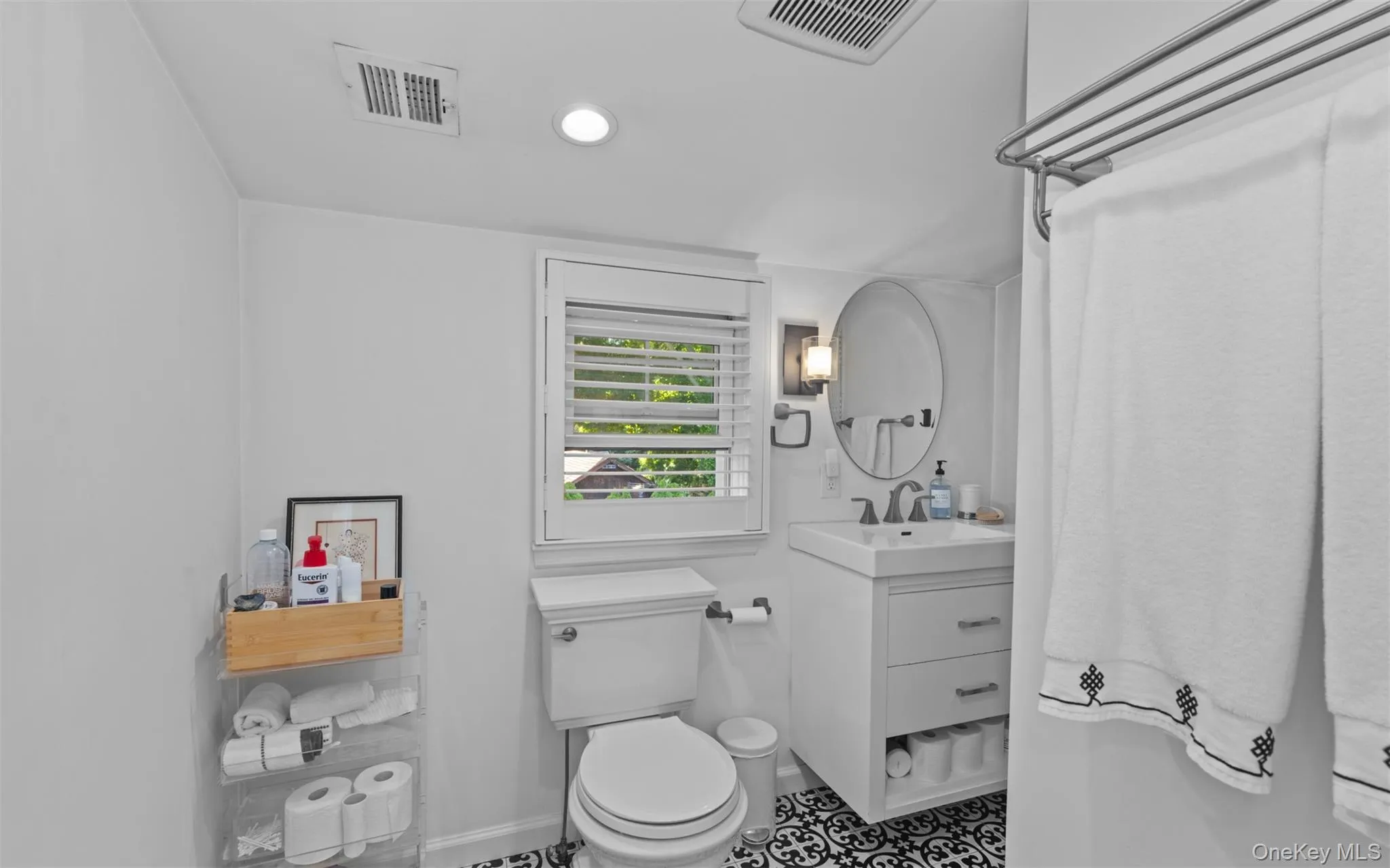 Second floor full bathroom with walk-in shower, vanity patterned floor tiles, and recessed lighting Second floor full bathroom with walk-in shower, vanity patterned floor tiles, and recessed lighting