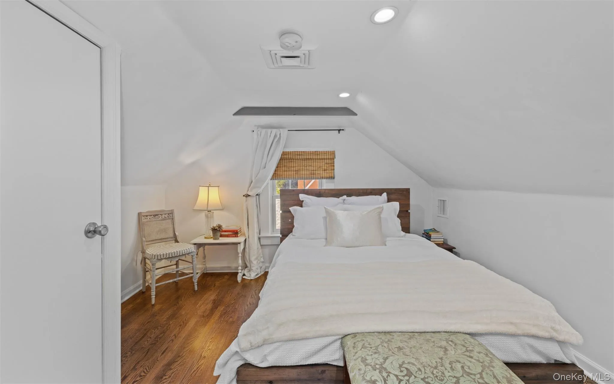 Second floor bedroom featuring recessed lighting, and hardwood flooring Second floor bedroom featuring recessed lighting, and hardwood flooring