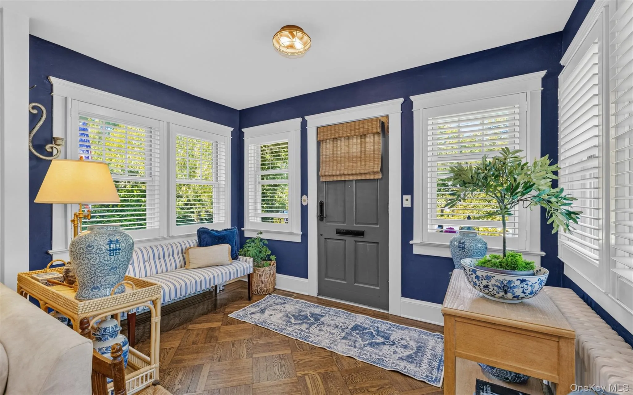 Entrance foyer with plantation shutters flooded with sunlight Entrance foyer with plantation shutters flooded with sunlight