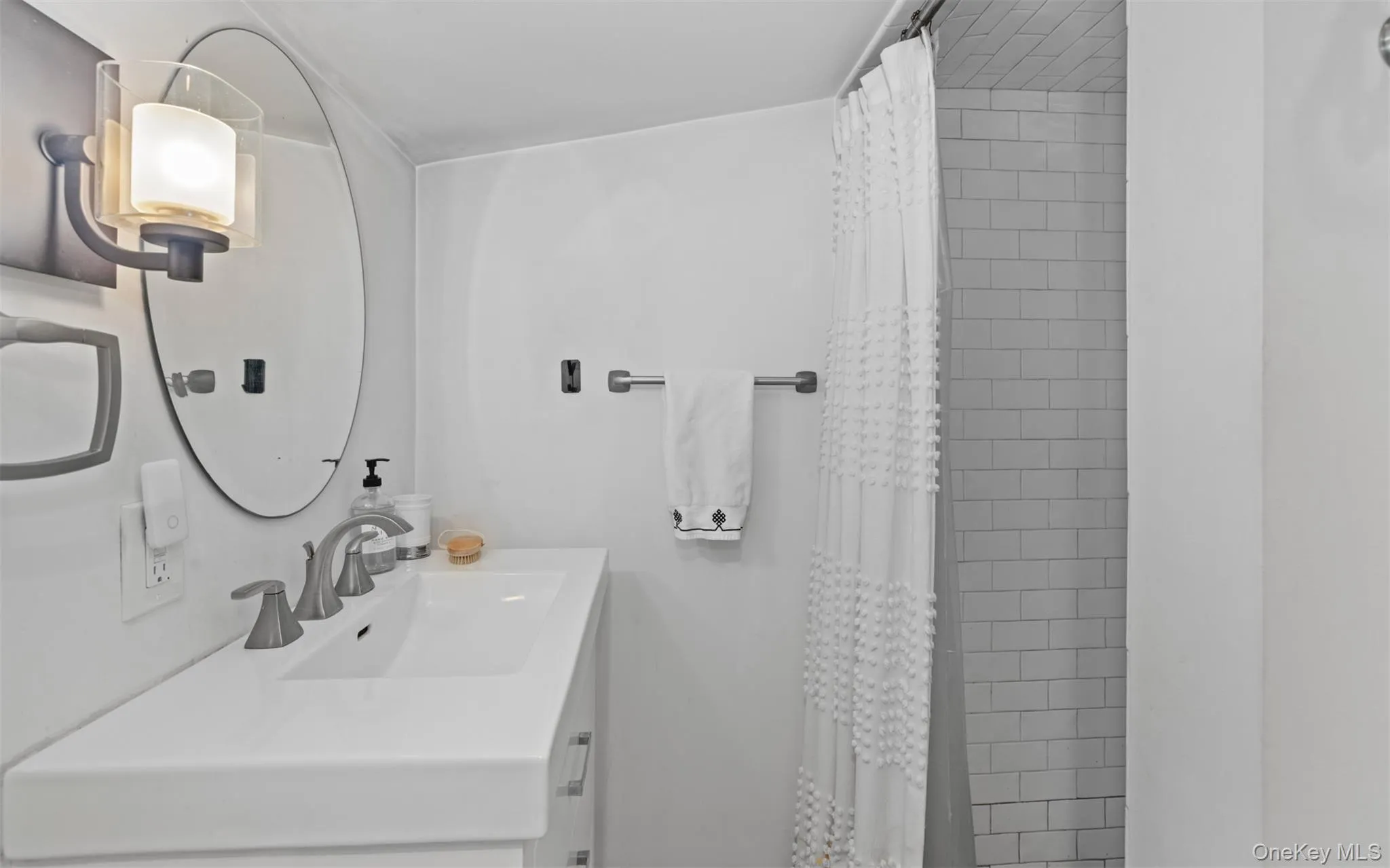 Second floor full bathroom with walk-in shower, vanity patterned floor tiles, and recessed lighting Second floor full bathroom with walk-in shower, vanity patterned floor tiles, and recessed lighting