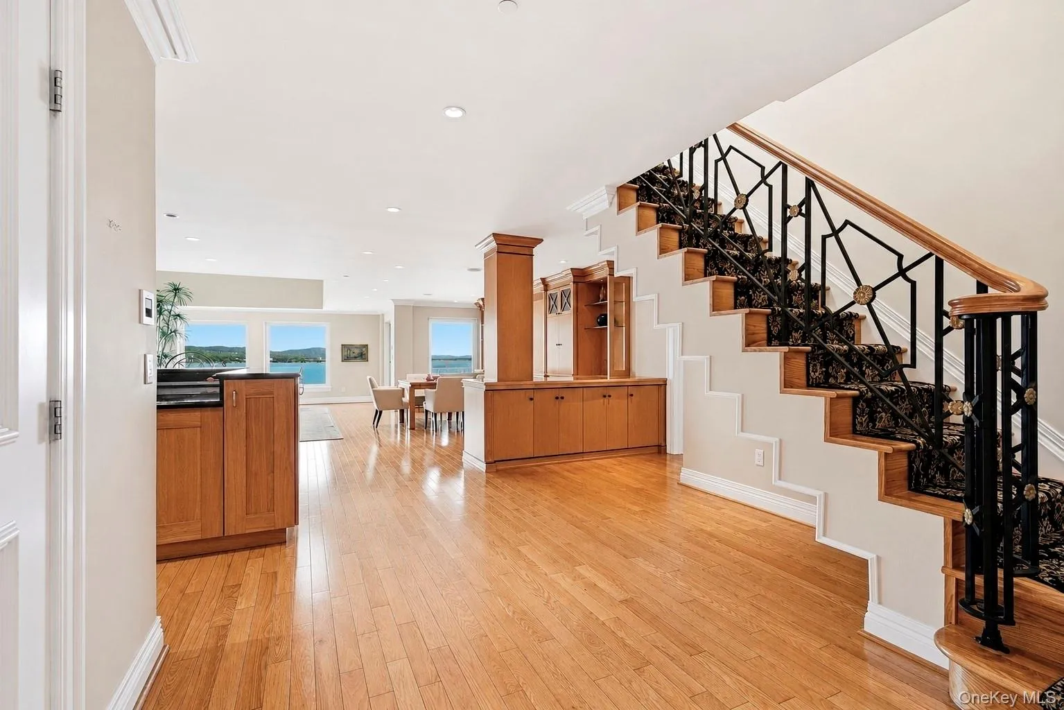 Entry foyer with grand staircase and gleaming hardwood floors. Entry foyer with grand staircase and gleaming hardwood floors.