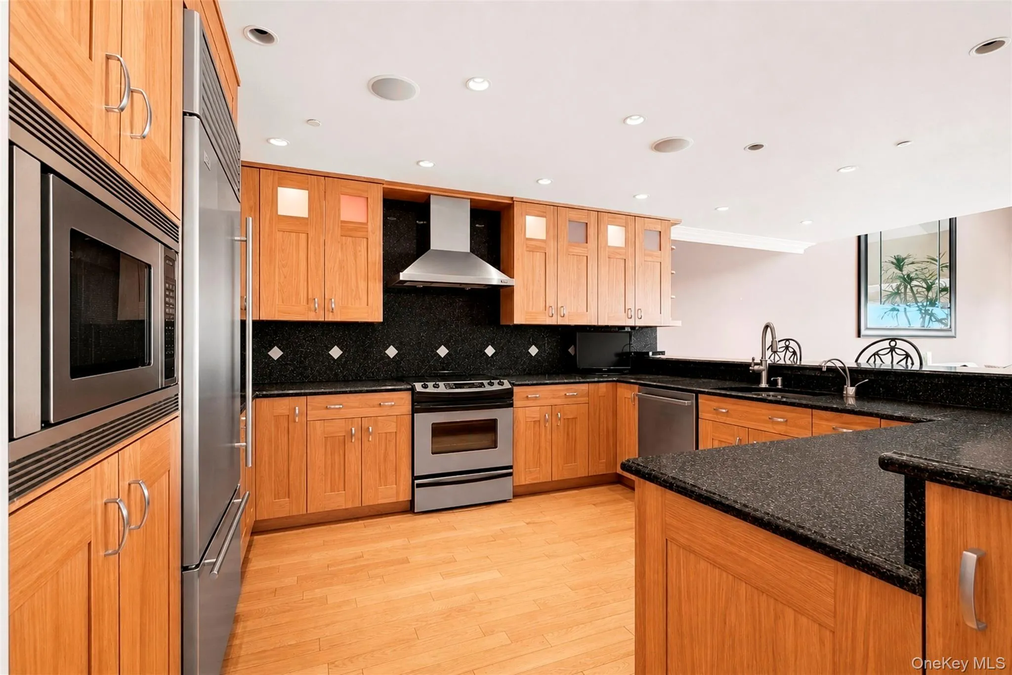 Open Kitchen with stainless steel appliances, hardwood floors and generous cabinetry. Open Kitchen with stainless steel appliances, hardwood floors and generous cabinetry.