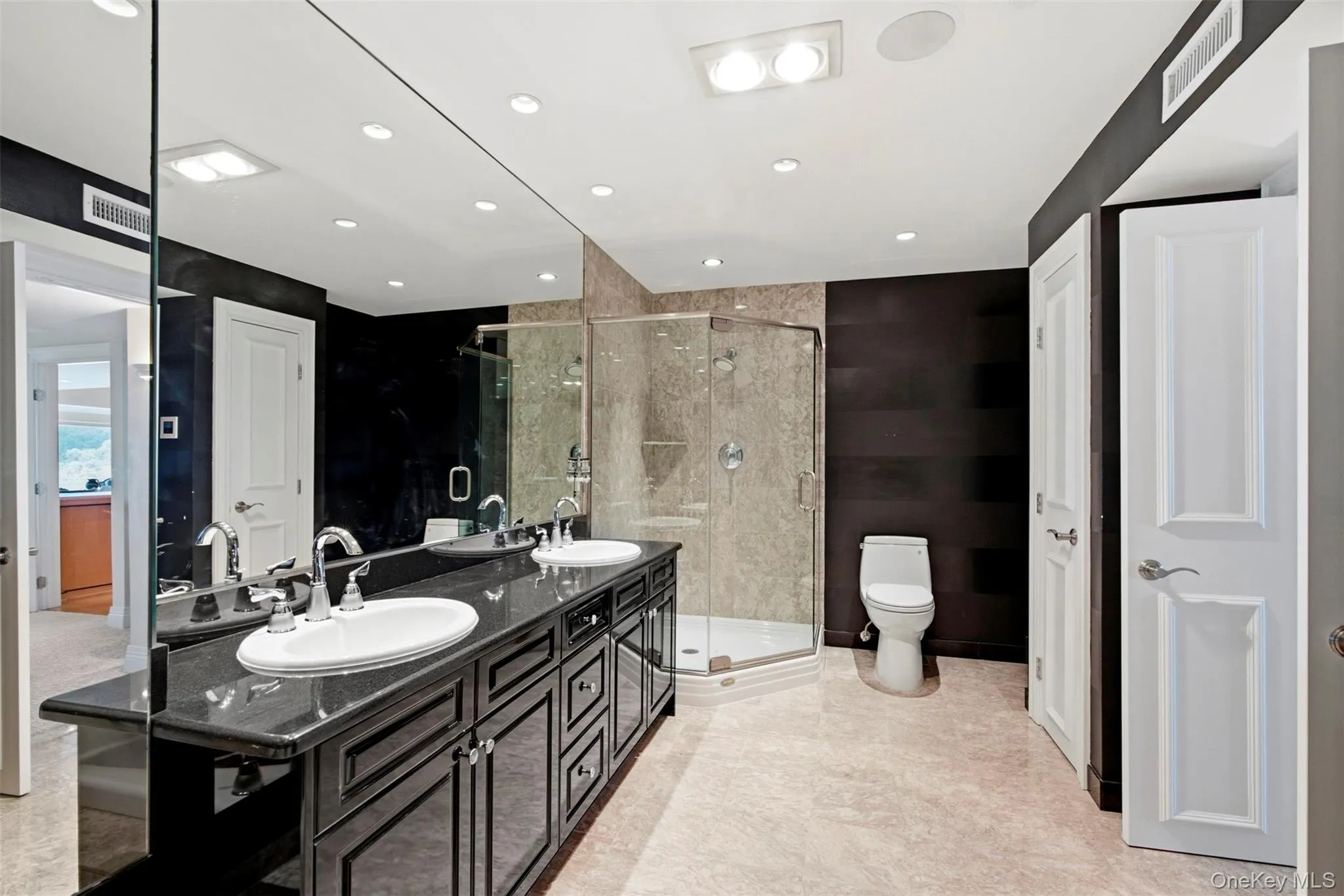 Walk-in marble shower. Walk-in marble shower.