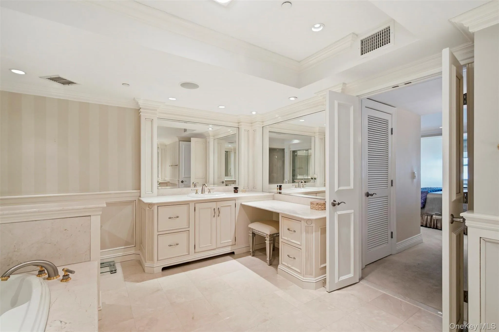 Another view of the upstair en suite bath showing the vanity and tray ceiling. Another view of the upstair en suite bath showing the vanity and tray ceiling.