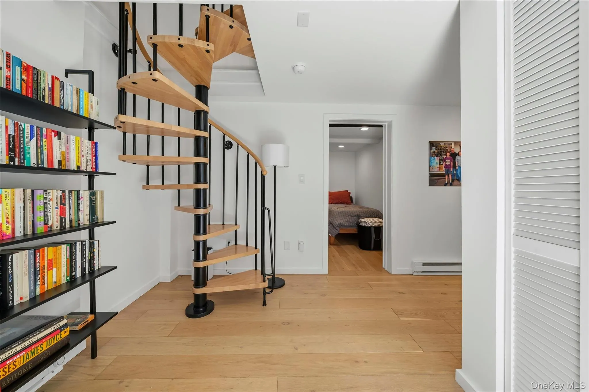 staircase to lower level foyer with reading nook and laundry staircase to lower level foyer with reading nook and laundry
