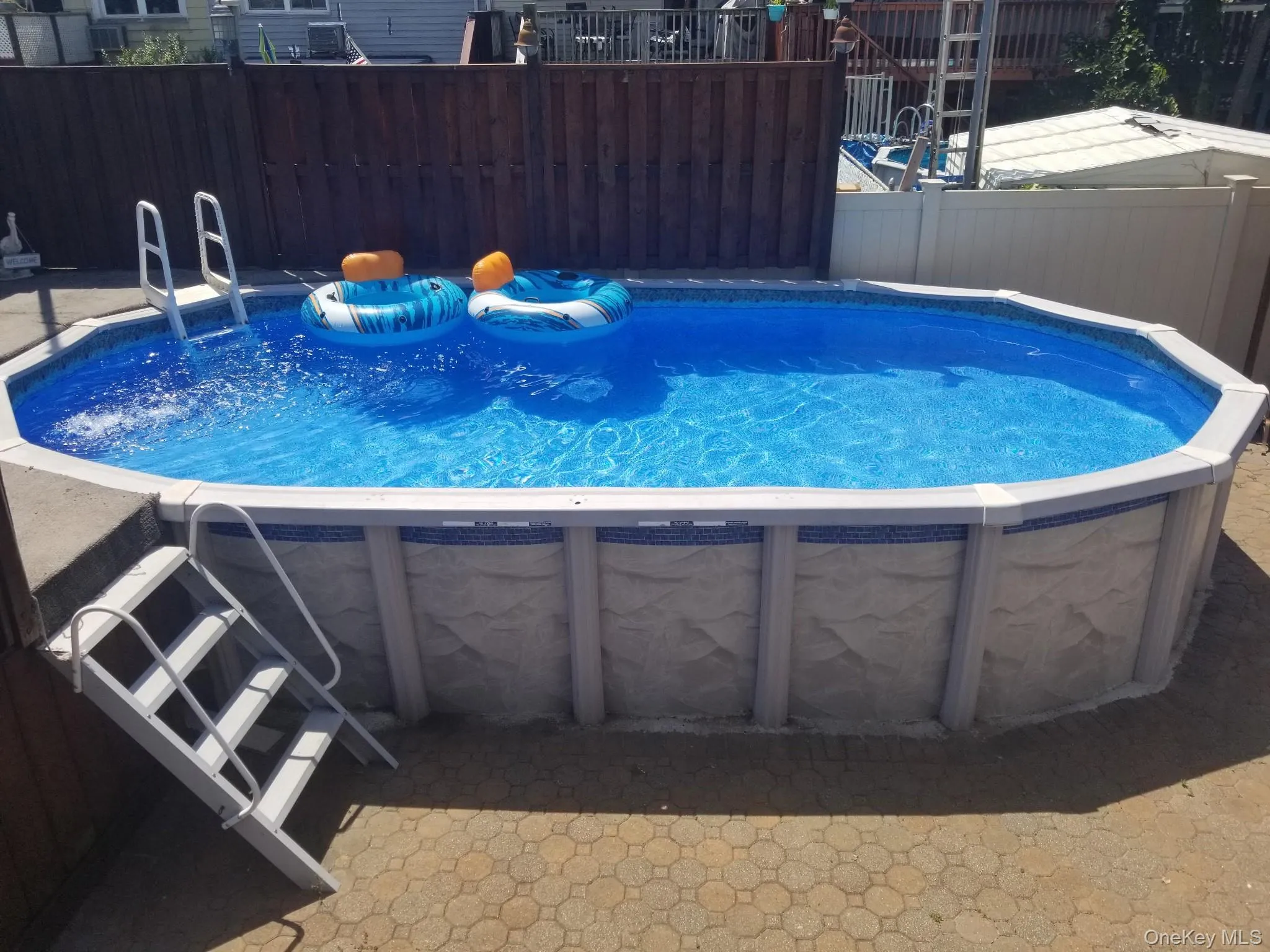 Above ground pool with deck. Refreshing on a hot summers' day! Above ground pool with deck. Refreshing on a hot summers' day!