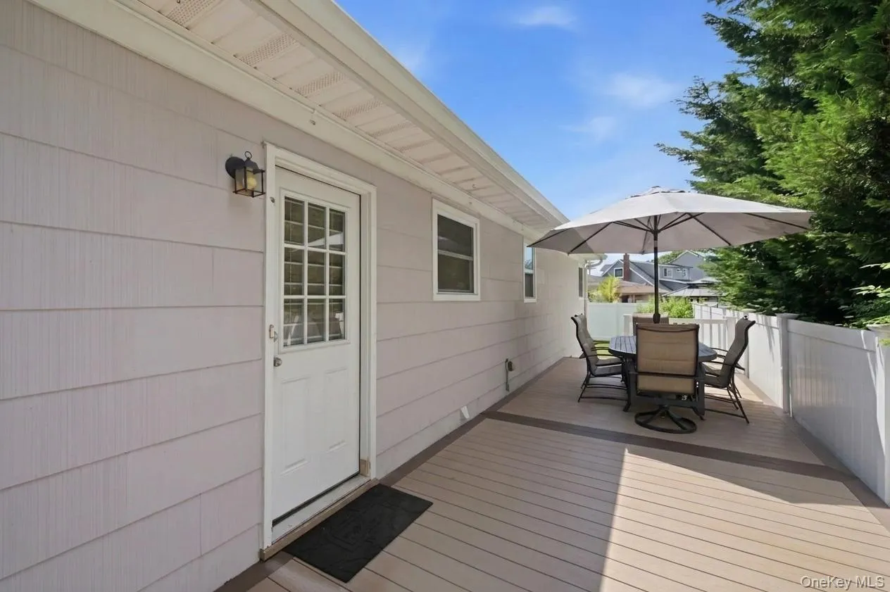Exterior deck with high quality trex-decking and a privacy fence Exterior deck with high quality trex-decking and a privacy fence