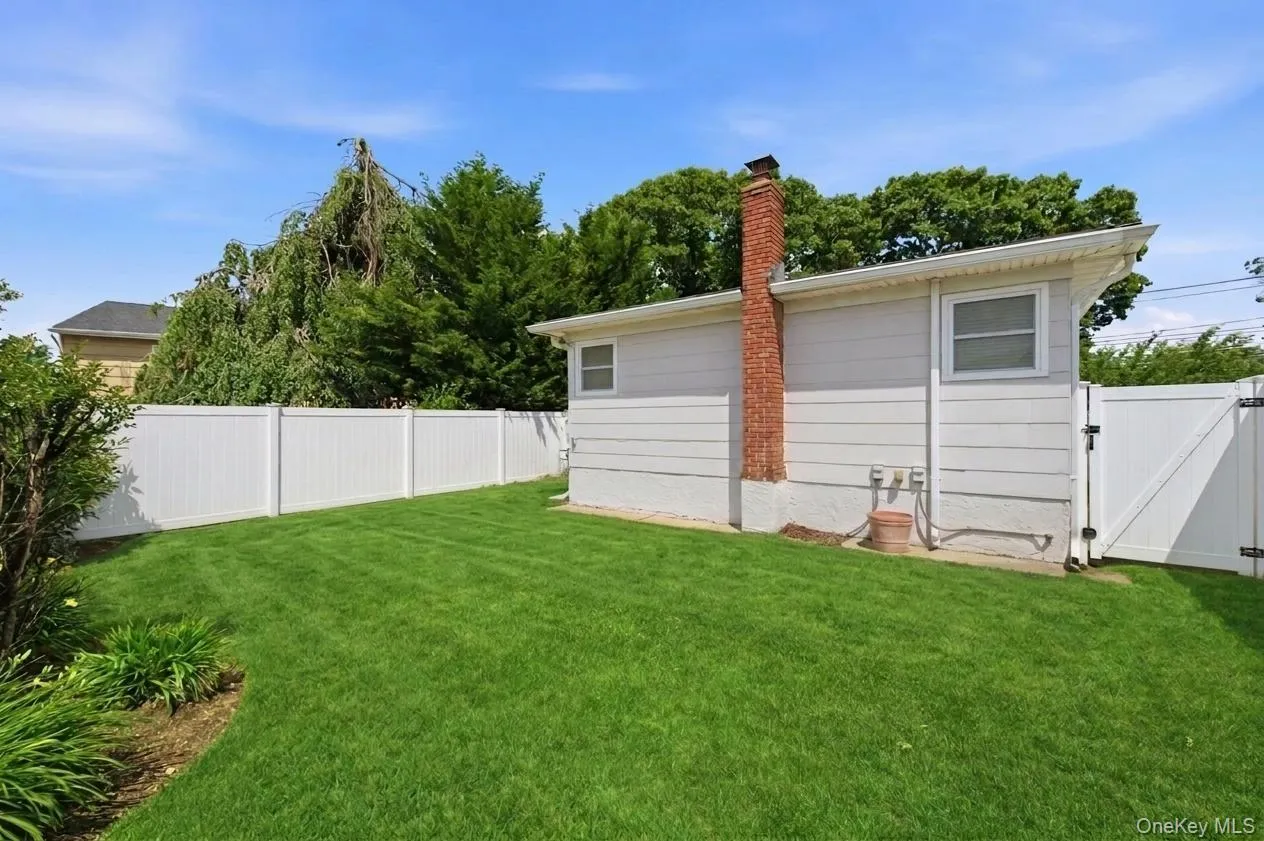 Fully fenced, flat & park-like yard Fully fenced, flat & park-like yard