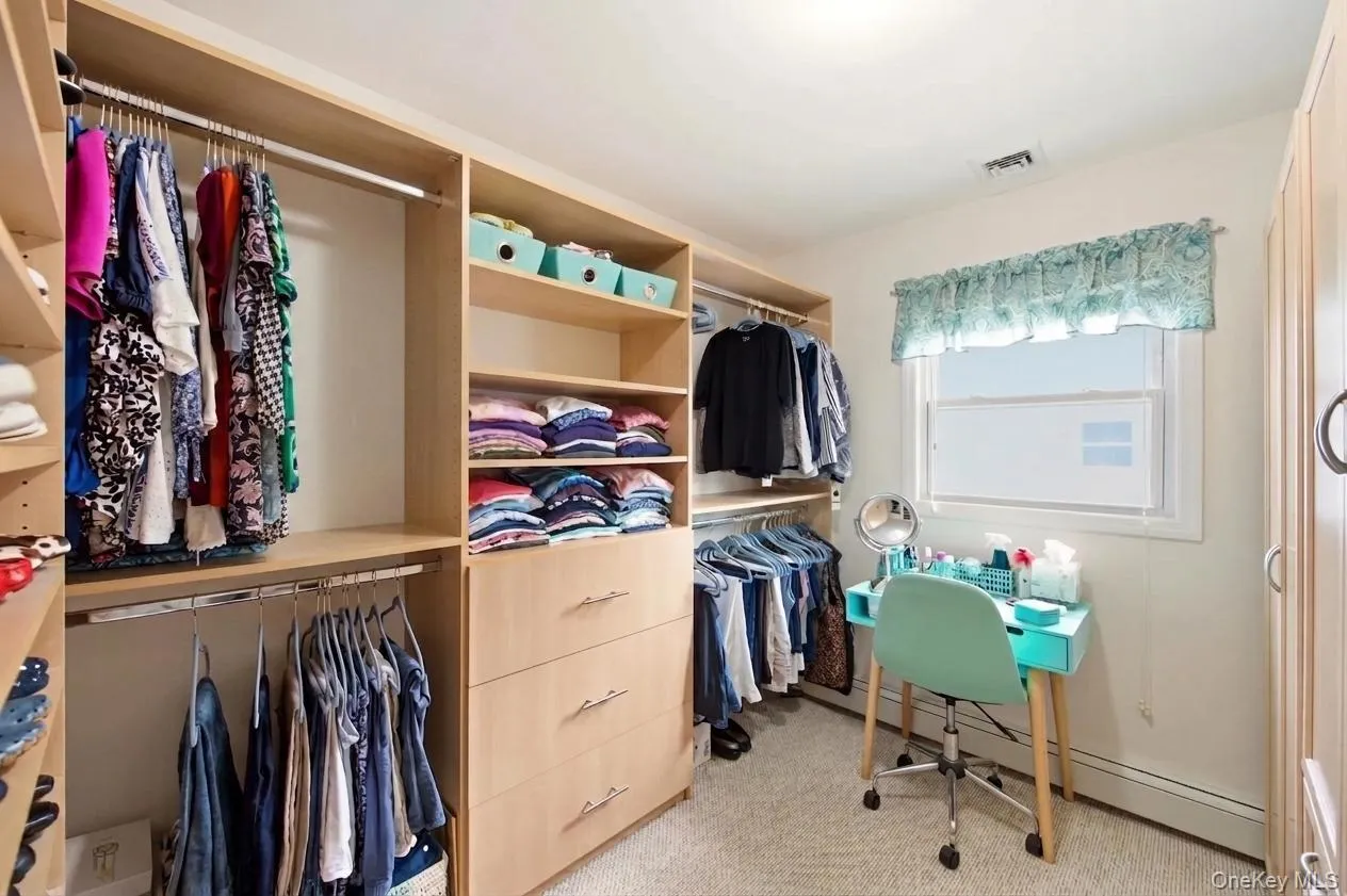 Bedroom (3)/Office converted to Walk-in Closet featuring custom built-in storage and wardrobing solutions Bedroom (3)/Office converted to Walk-in Closet featuring custom built-in storage and wardrobing solutions