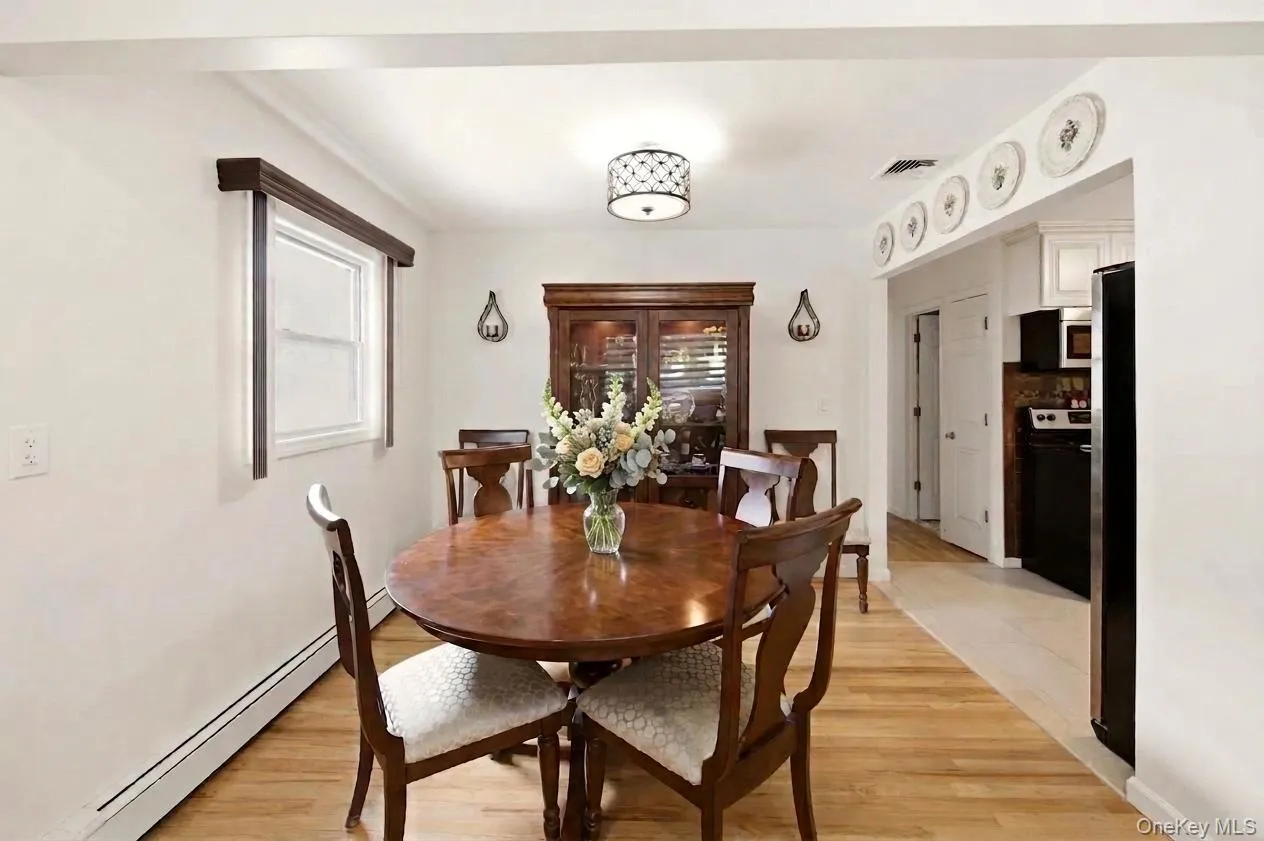 Open-concept living and dining areas featuring beautiful gleaming hard wood floors, recessed lighting, and a versatile floor-plan. Open-concept living and dining areas featuring beautiful gleaming hard wood floors, recessed lighting, and a versatile floor-plan.