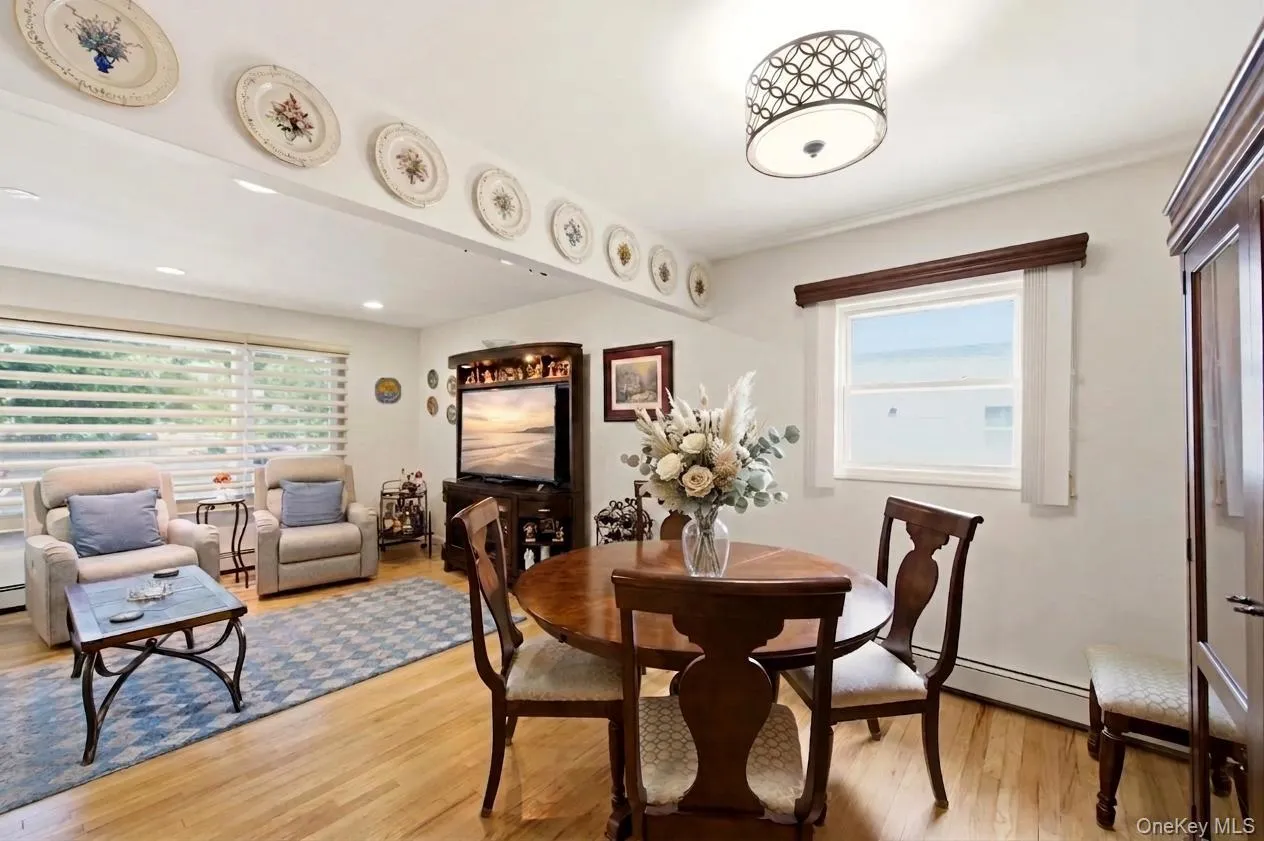 Open-concept living and dining areas featuring beautiful gleaming hard wood floors, recessed lighting, and a versatile floor-plan. Open-concept living and dining areas featuring beautiful gleaming hard wood floors, recessed lighting, and a versatile floor-plan.
