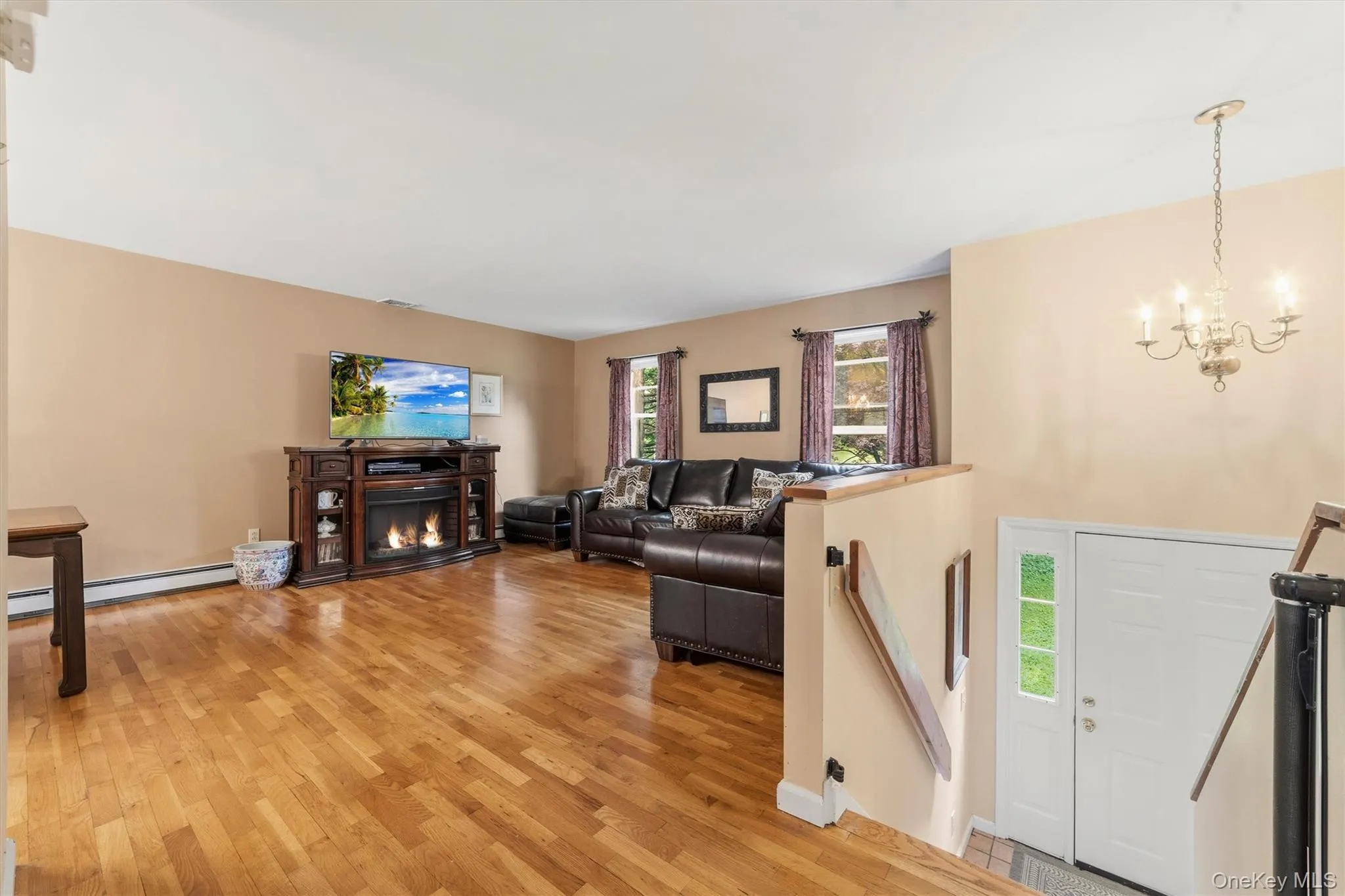 Living Room open to Dining with Hard Wood Floors Living Room open to Dining with Hard Wood Floors