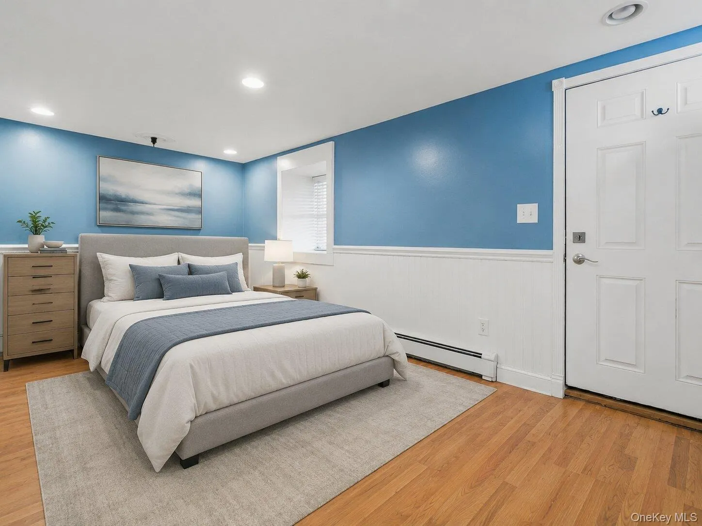 Virtually staged basement bedroom showcasing a comfortable bed setup, soft lighting, and neutral décor to help buyers visualize the space as a private guest room, home office, or additional bedroom. Virtually staged basement bedroom showcasing a comfortable bed setup, soft lighting, and neutral décor to help buyers visualize the space as a private guest room, home office, or additional bedroom.