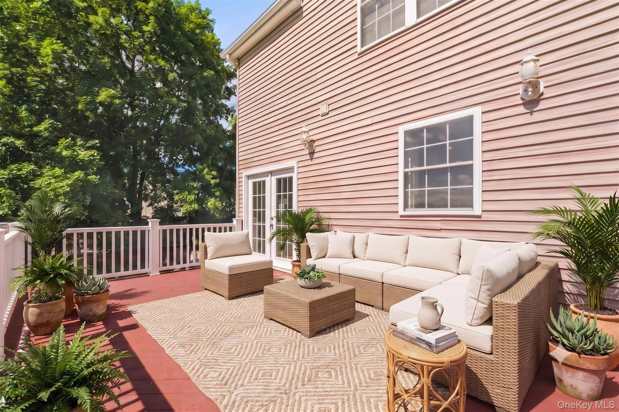 Virtually Staged. Spacious outdoor deck with white railing, red-toned decking, exterior access, and peaceful water views, offering a great space for relaxing, outdoor dining, or enjoying the surrounding scenery. Virtually Staged. Spacious outdoor deck with white railing, red-toned decking, exterior access, and peaceful water views, offering a great space for relaxing, outdoor dining, or enjoying the surrounding scenery.