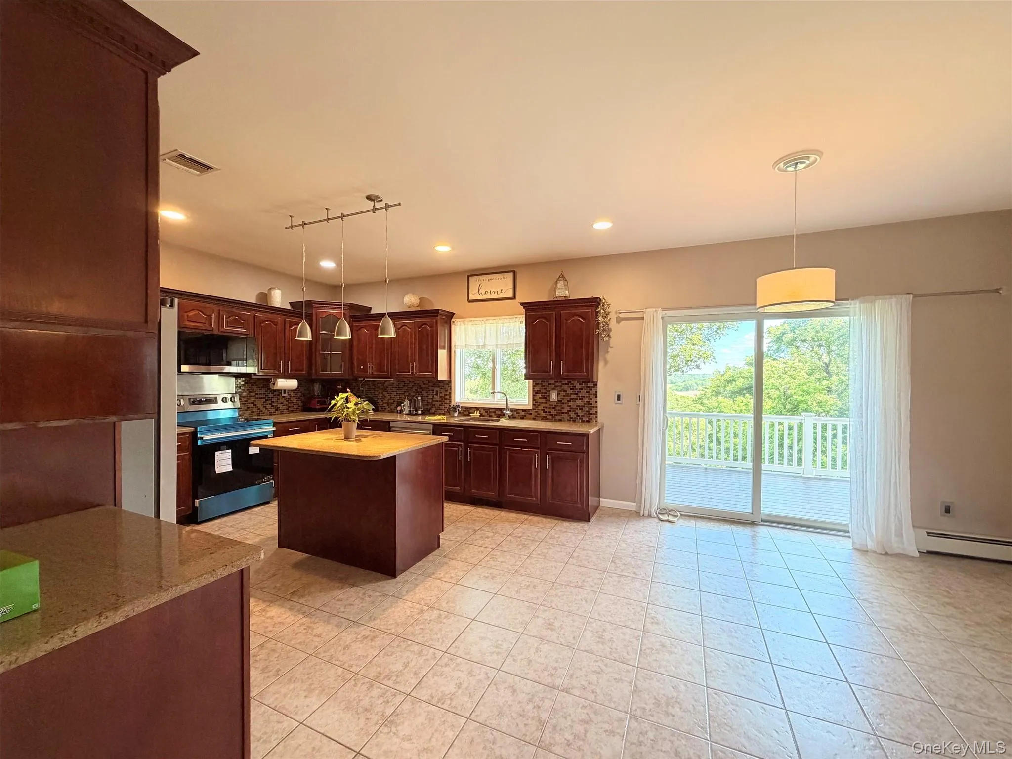 Kitchen and Dinette with slider to the deck. Kitchen and Dinette with slider to the deck.