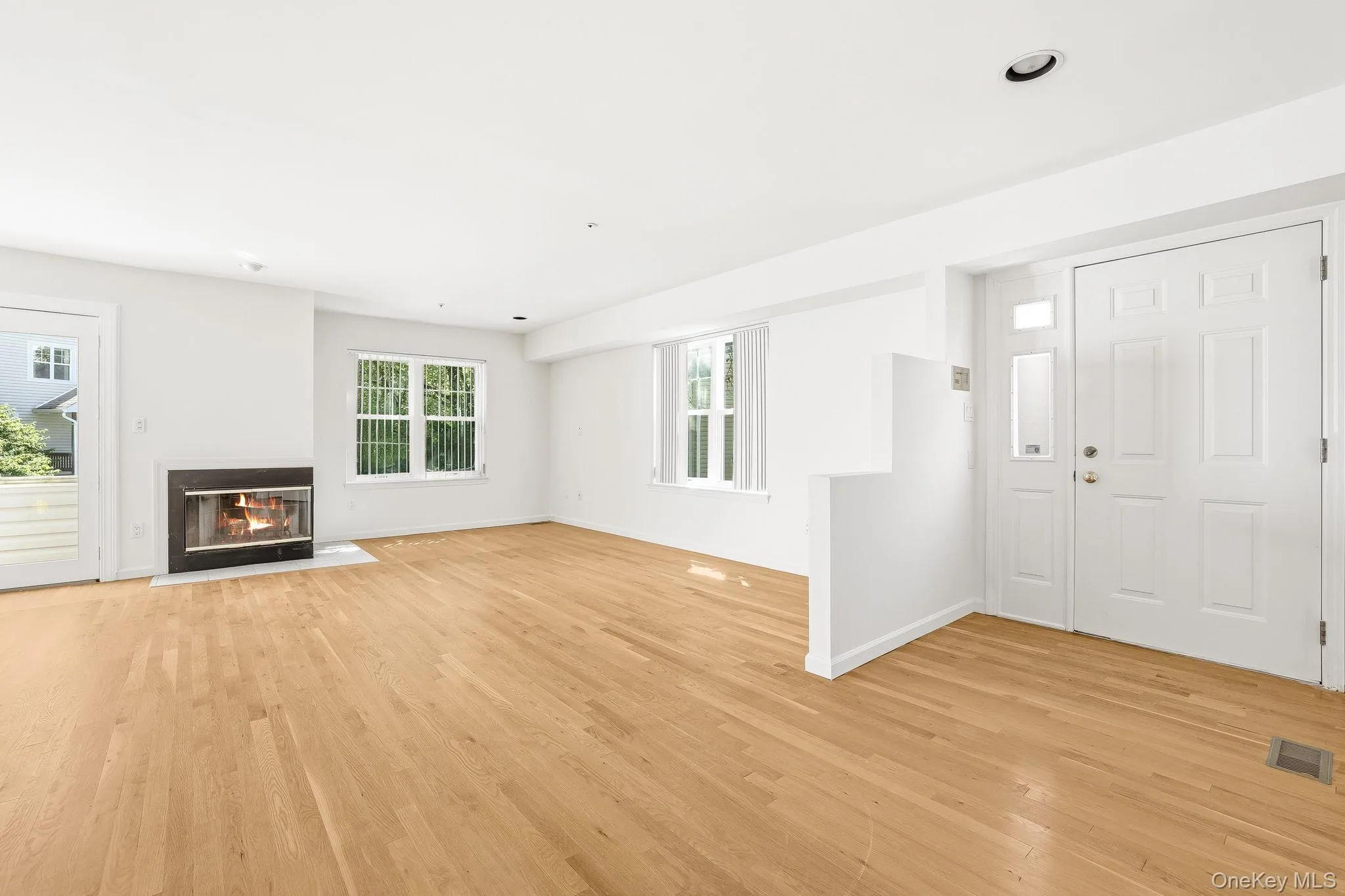 This entry foyer opens to the enormous living room and note the well-maintained wood flooring This entry foyer opens to the enormous living room and note the well-maintained wood flooring
