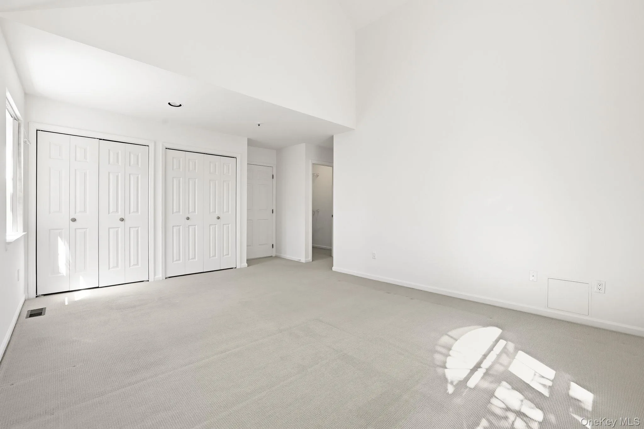 There are 2 sets of double-door closets in this bedroom, in addition to a walk-in closet There are 2 sets of double-door closets in this bedroom, in addition to a walk-in closet