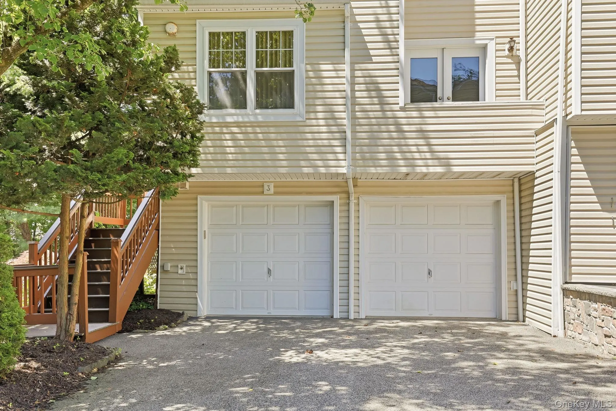 Townhouse #3 has a 2-car garage, with driveway for 4 more cars and stairs to the front porch Townhouse #3 has a 2-car garage, with driveway for 4 more cars and stairs to the front porch