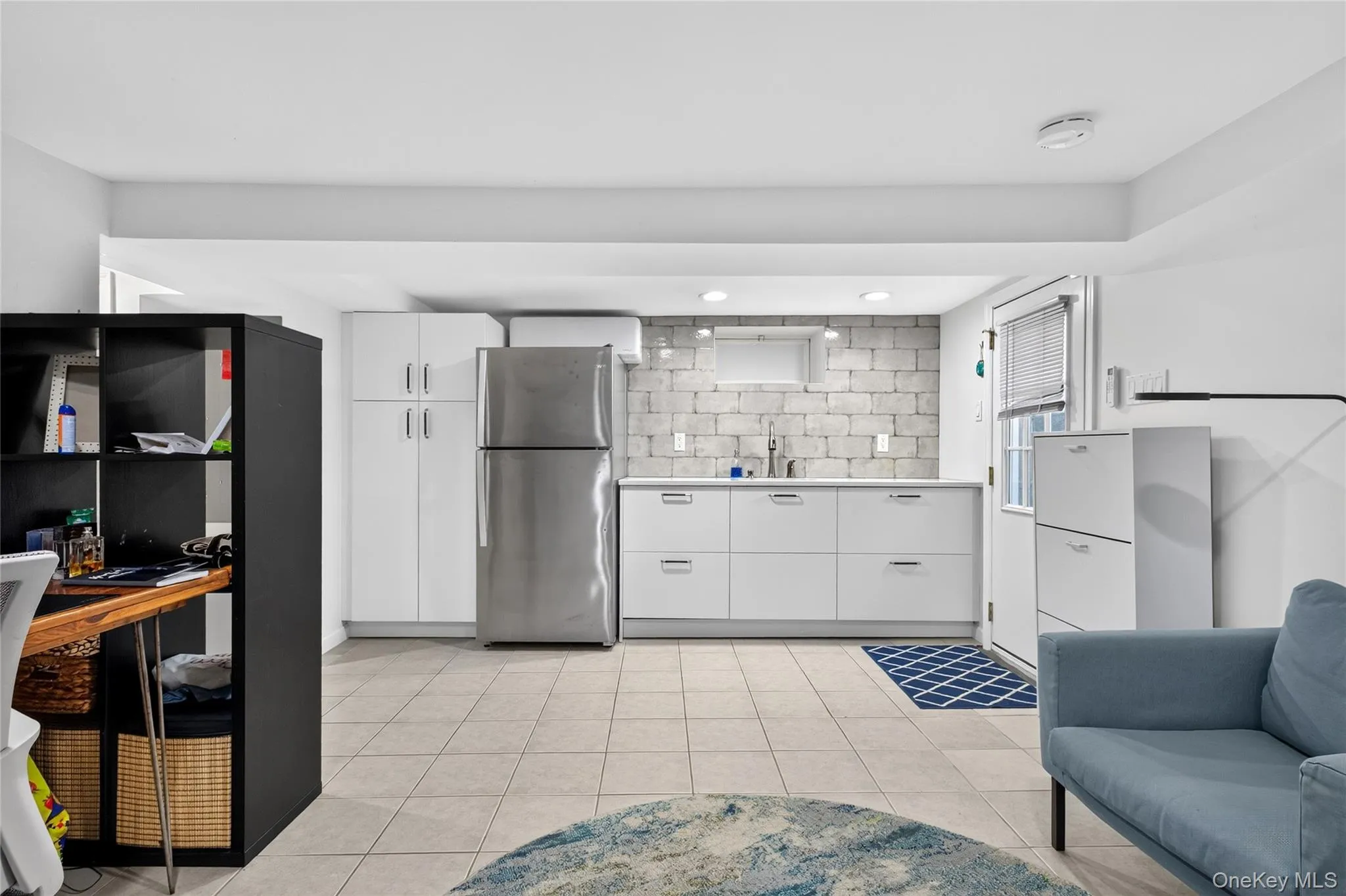 Lower level kitchenette and large bonus room Lower level kitchenette and large bonus room
