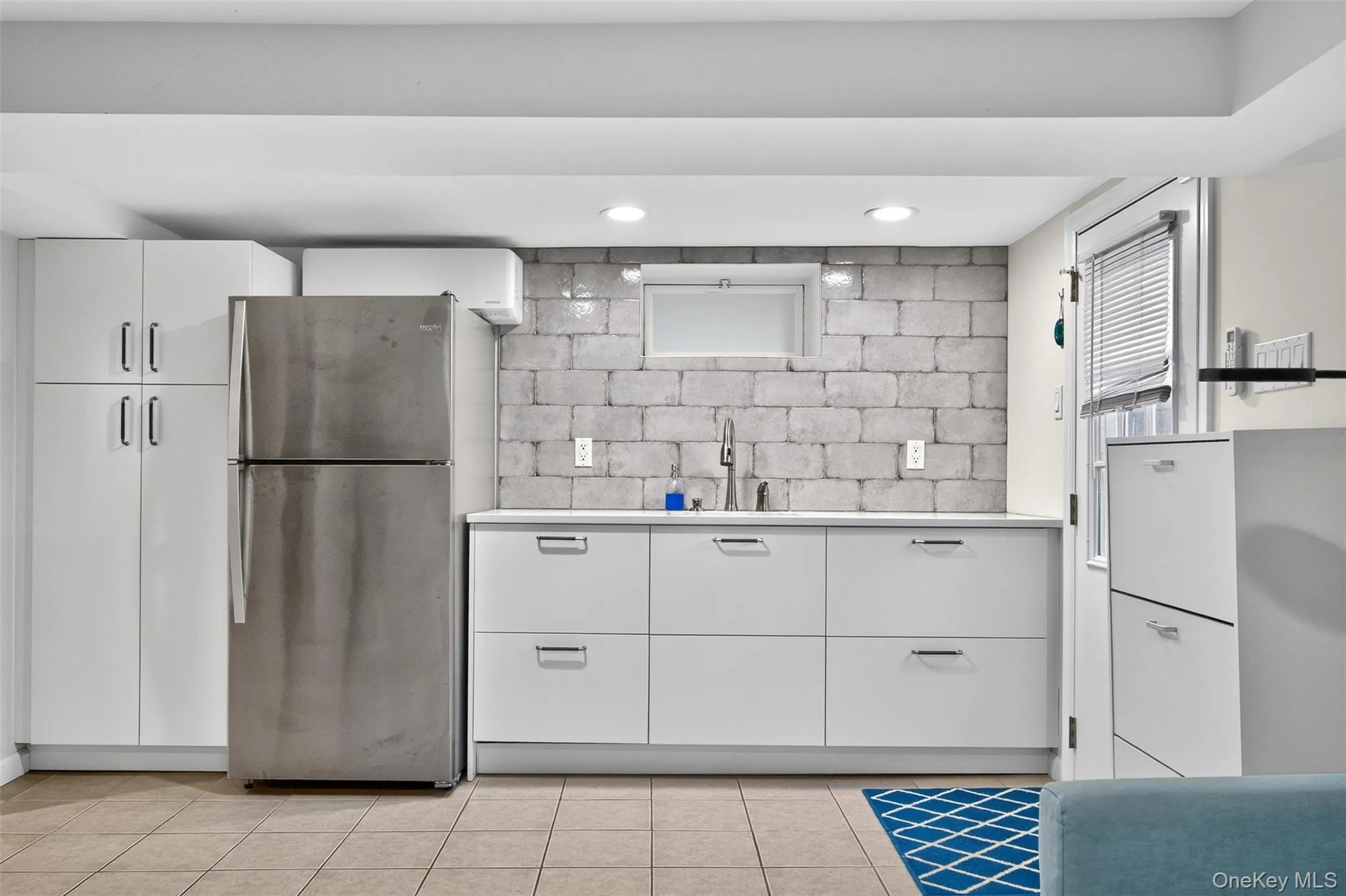 Lower level kitchenette with door to backyard Lower level kitchenette with door to backyard