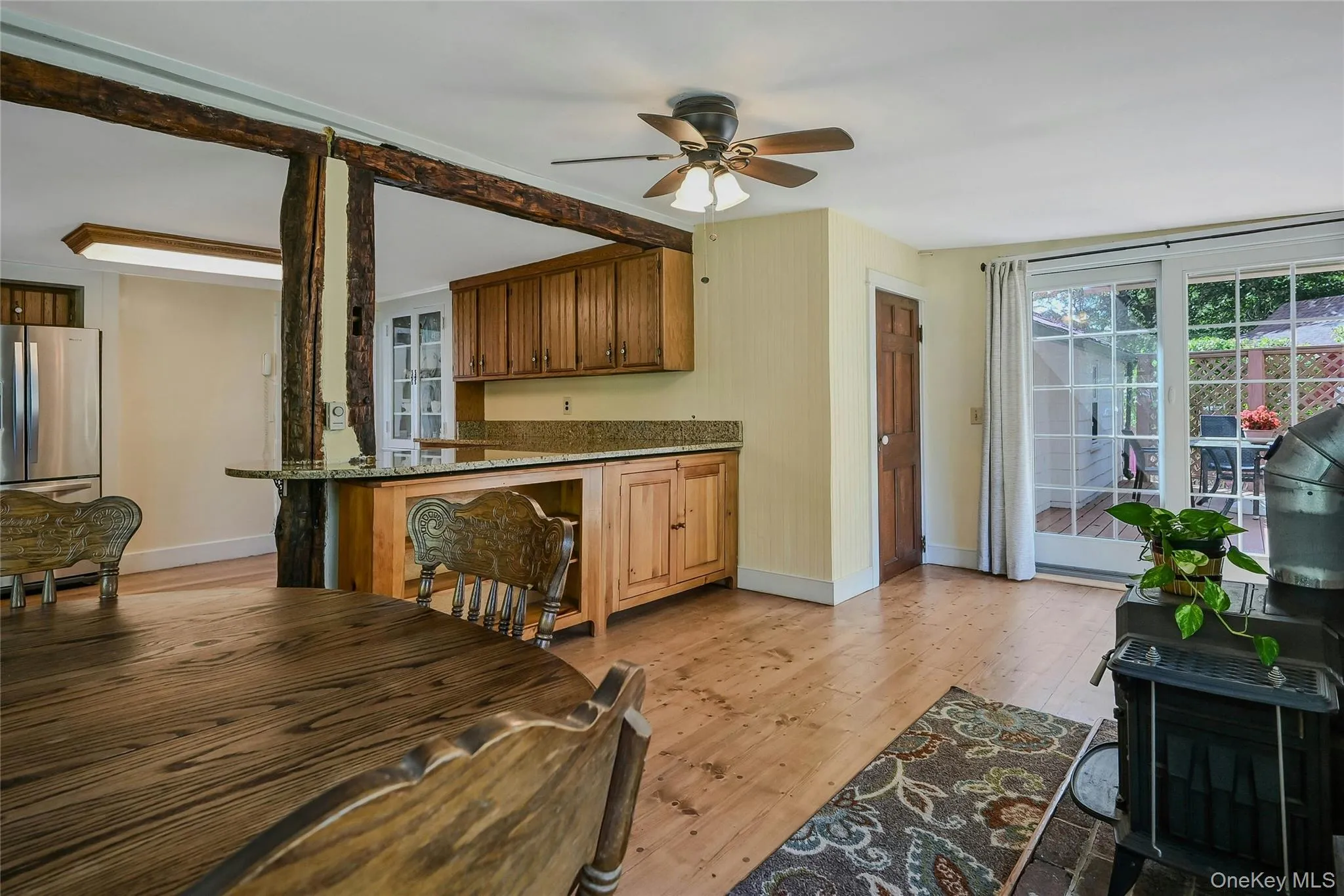 Den with access to the back deck and wood burning stove Den with access to the back deck and wood burning stove
