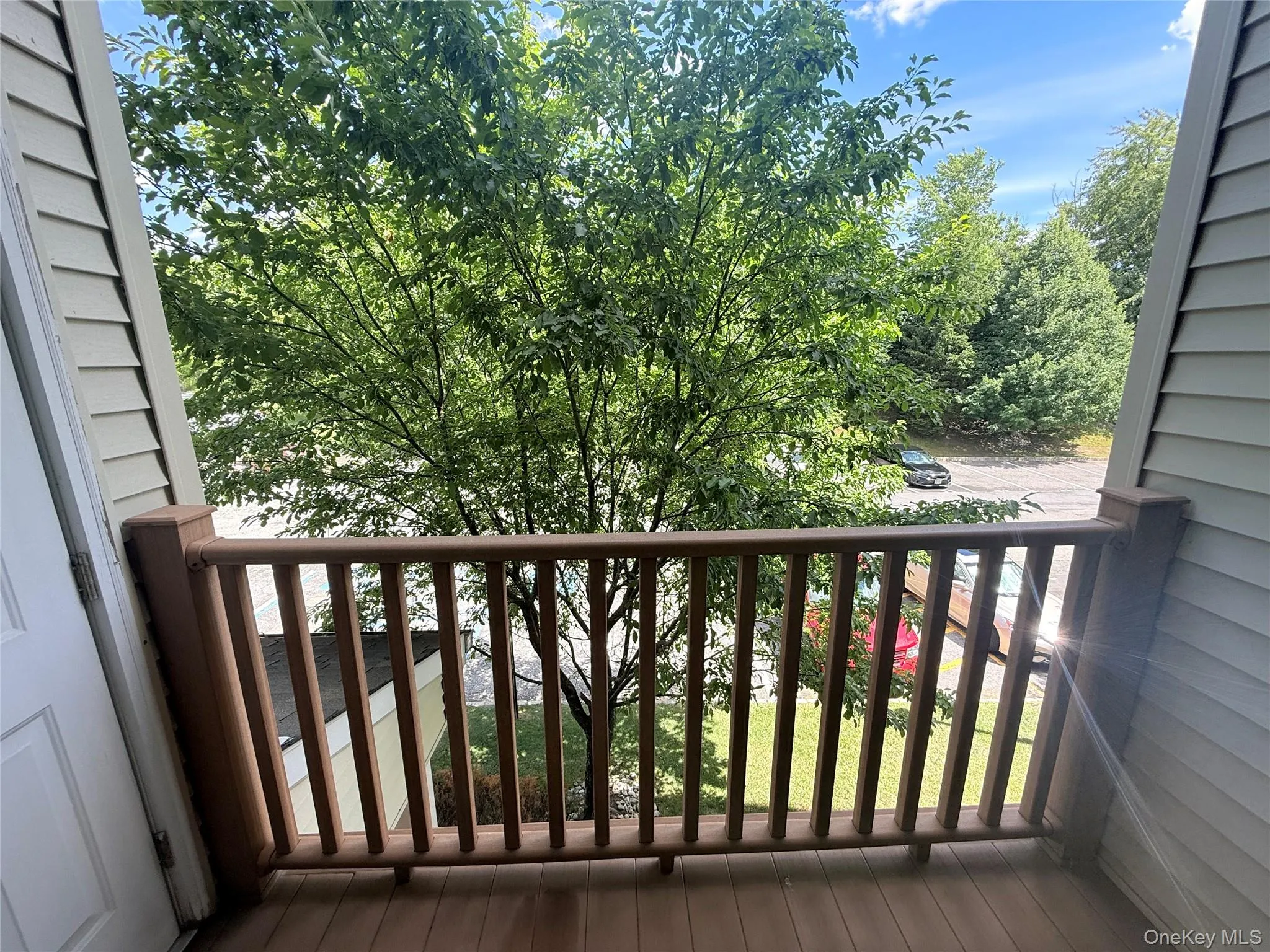 Private balcony featuring composite decking and a coordinating railing system Private balcony featuring composite decking and a coordinating railing system