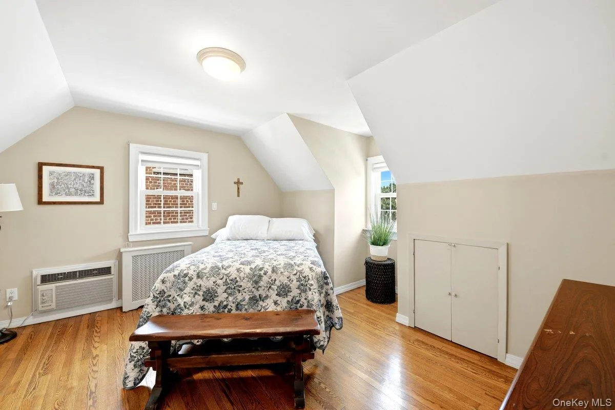 Hardwood flooring and sloped ceilings define this 2nd floor bedroom Hardwood flooring and sloped ceilings define this 2nd floor bedroom