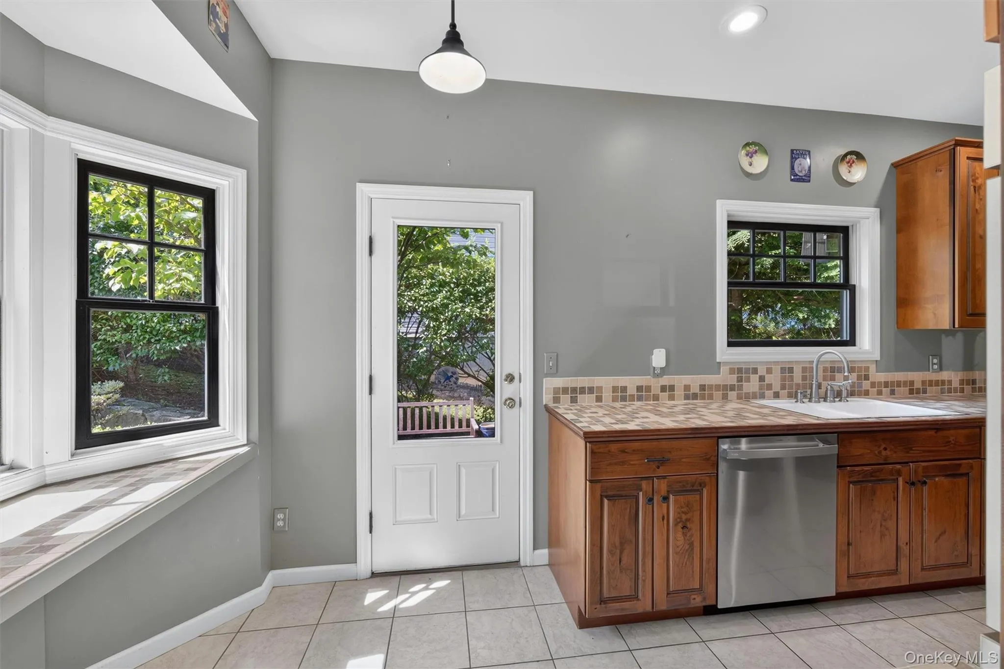 View of the eat-in-kitchen with door to yard. View of the eat-in-kitchen with door to yard.