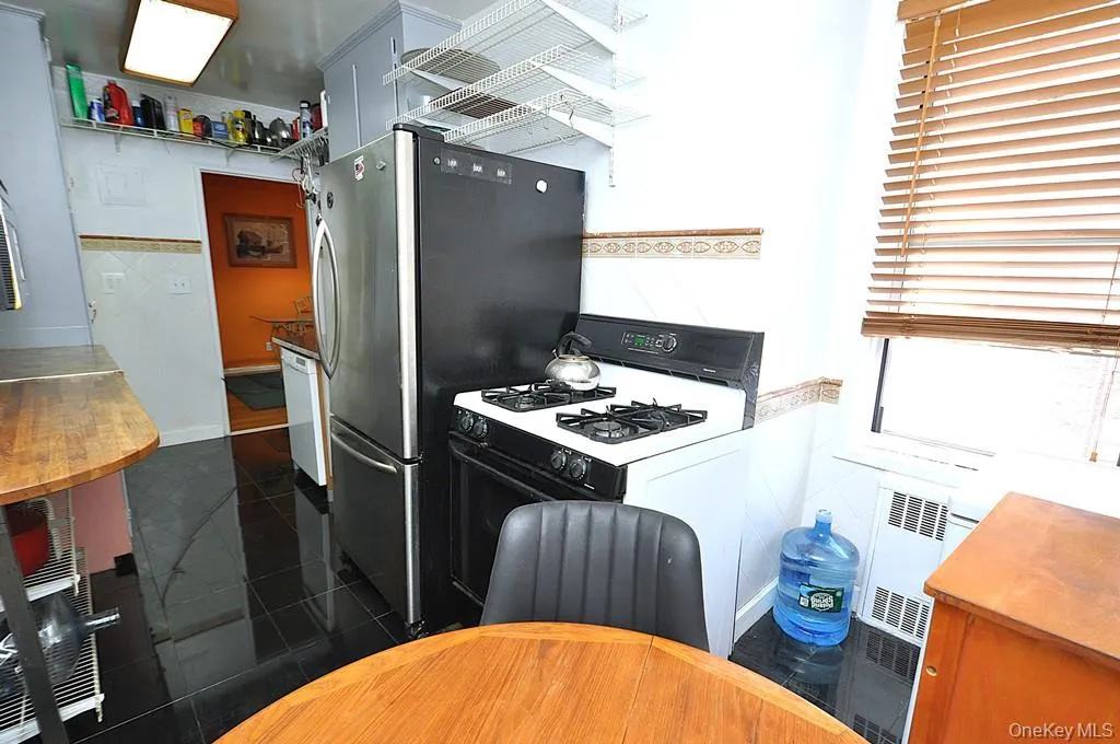Eat-in-Kitchen has a range, dishwasher, stainless steel refrigerator and stainless steel microwave. There is a window for natural light and fresh air. Eat-in-Kitchen has a range, dishwasher, stainless steel refrigerator and stainless steel microwave. There is a window for natural light and fresh air.