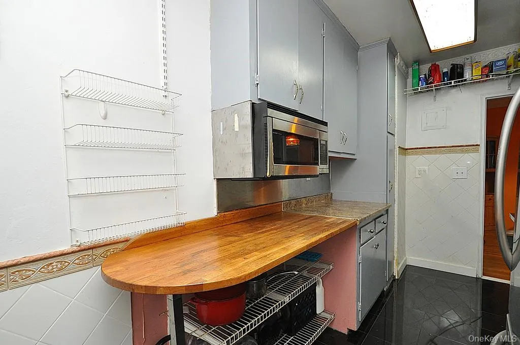 Eat-in-Kitchen has a range, dishwasher, stainless steel refrigerator and stainless steel microwave. There is a window for natural light and fresh air. Eat-in-Kitchen has a range, dishwasher, stainless steel refrigerator and stainless steel microwave. There is a window for natural light and fresh air.