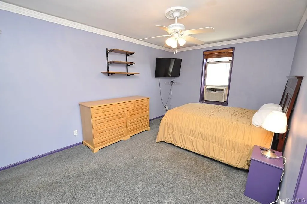 Large Corner Bedroom with two closets and covered hardwood floors. Large Corner Bedroom with two closets and covered hardwood floors.