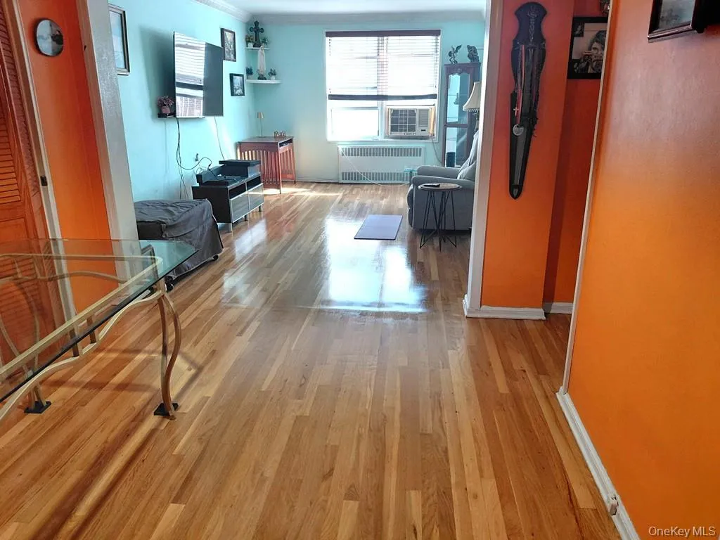 The bright and airy living room opens to the Dining foyer and has covered hardwood floors. The bright and airy living room opens to the Dining foyer and has covered hardwood floors.