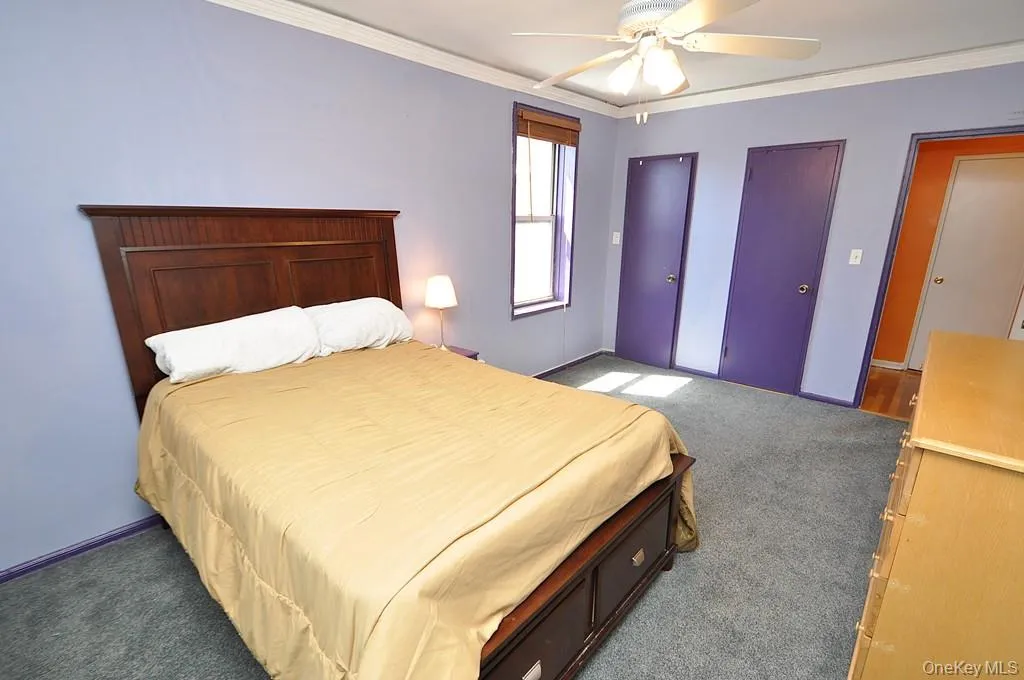 Large Corner Bedroom with two closets and covered hardwood floors. Large Corner Bedroom with two closets and covered hardwood floors.
