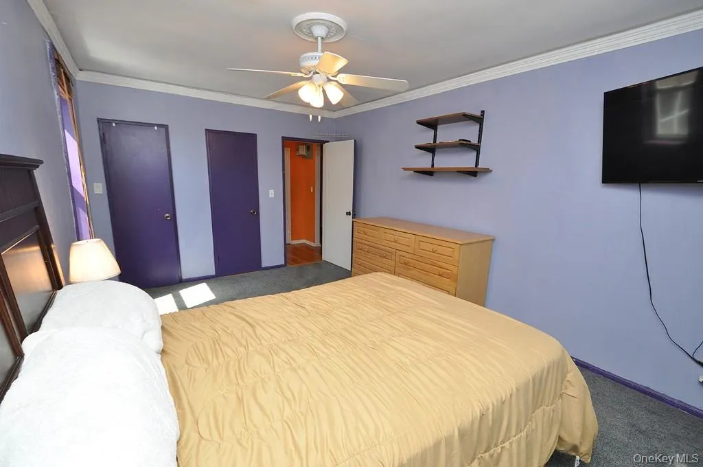Large Corner Bedroom with two closets and covered hardwood floors. Large Corner Bedroom with two closets and covered hardwood floors.