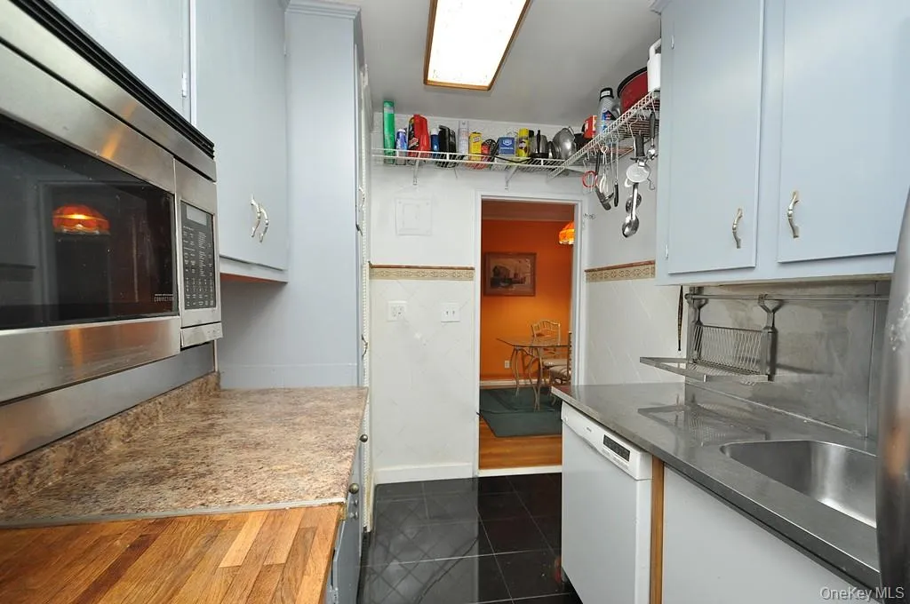Eat-in-Kitchen has a range, dishwasher, stainless steel refrigerator and stainless steel microwave. There is a window for natural light and fresh air. Eat-in-Kitchen has a range, dishwasher, stainless steel refrigerator and stainless steel microwave. There is a window for natural light and fresh air.