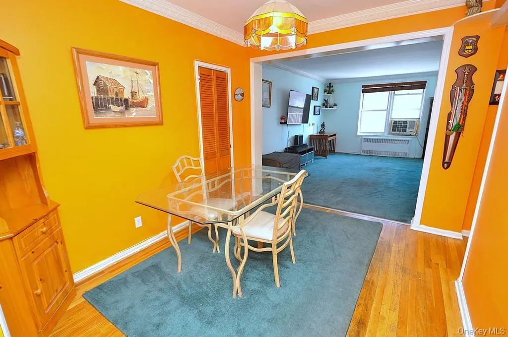 The dining area opens to the living room and has hardwood floors. The dining area opens to the living room and has hardwood floors.