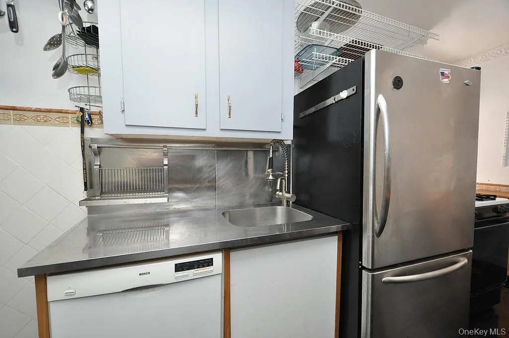 Eat-in-Kitchen has a range, dishwasher, stainless steel refrigerator and stainless steel microwave. There is a window for natural light and fresh air. Eat-in-Kitchen has a range, dishwasher, stainless steel refrigerator and stainless steel microwave. There is a window for natural light and fresh air.