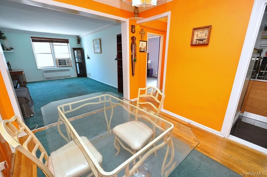 The dining area opens to the living room and has hardwood floors. The dining area opens to the living room and has hardwood floors.