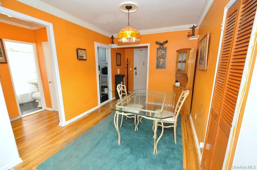 The dining area opens to the living room and has hardwood floors. The dining area opens to the living room and has hardwood floors.