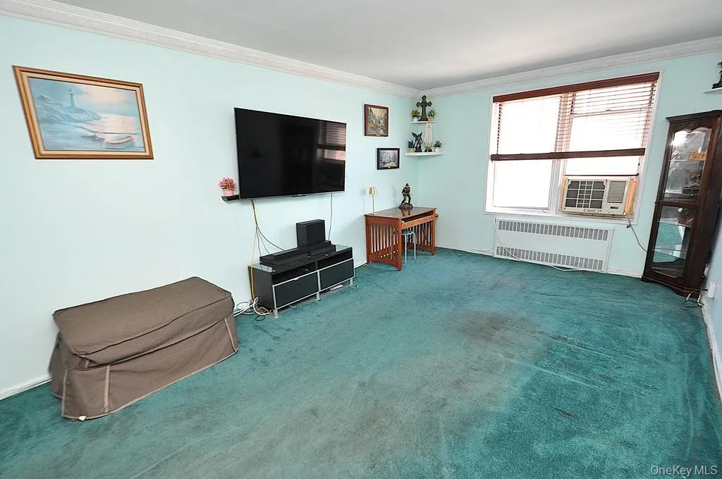The bright and airy living room opens to the Dining foyer and has covered hardwood floors. The bright and airy living room opens to the Dining foyer and has covered hardwood floors.