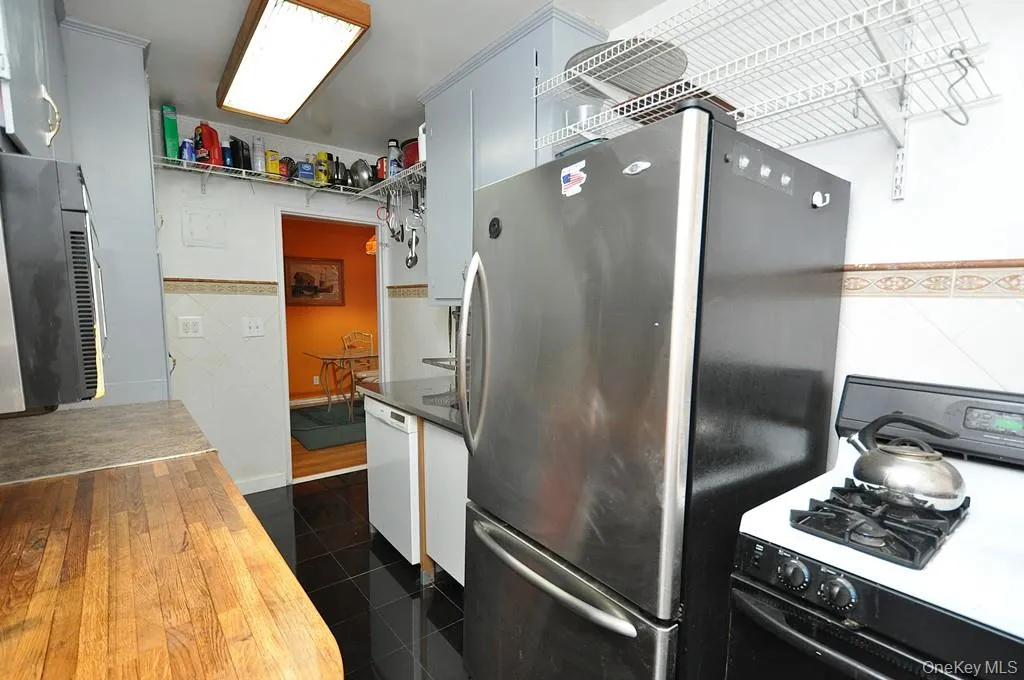 Eat-in-Kitchen has a range, dishwasher, stainless steel refrigerator and stainless steel microwave. There is a window for natural light and fresh air. Eat-in-Kitchen has a range, dishwasher, stainless steel refrigerator and stainless steel microwave. There is a window for natural light and fresh air.