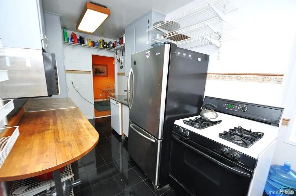 Eat-in-Kitchen has a range, dishwasher, stainless steel refrigerator and stainless steel microwave. There is a window for natural light and fresh air. Eat-in-Kitchen has a range, dishwasher, stainless steel refrigerator and stainless steel microwave. There is a window for natural light and fresh air.